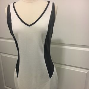 White dress with faux leather black sides.